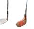 Vintage iron and wooden golf club heads displayed on a clean white background.